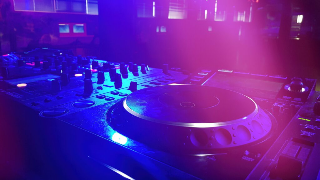 DJ booth at the night club with DJ console, closeup